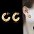 1 paire de boucles d'oreilles en acier inoxydable plaqué or 18 carats, style simple, couleur unie