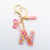 Casual Simple Style Letter Flower Butterfly Plastic Resin Sequins Epoxy Bag Pendant Keychain