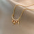 Elegant Simple Style Geometric Titanium Steel Plating Inlay Artificial Pearls Shell Zircon Necklace