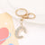 Korean Style Letter Zinc Alloy Inlay Artificial Gemstones Unisex Bag Pendant Keychain