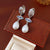 Luxurious Round Droplet Geometric Artificial Pearl Zircon Inlay Earrings