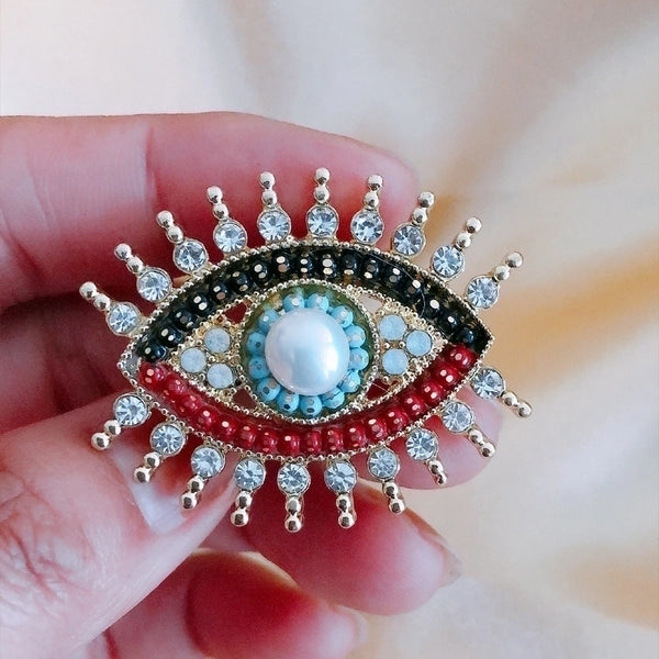 Retro Pin Devil'S Eye Alloy Pearl Inlay Artificial Gemstones Unisex Brooches