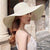 Women's Vacation Solid Color Bowknot Big Eaves Straw Hat